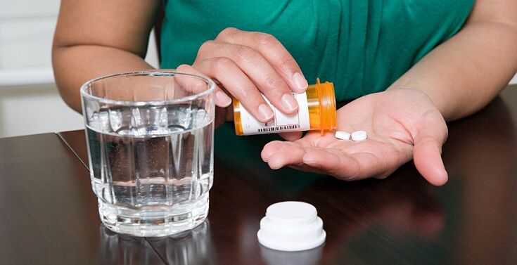 pillen slikken om pijn in de onderrug te verlichten
